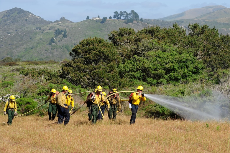 VANDENBERG AIR FORCE BASE, Calif. – 30th Civil Engineer Squadron firefighters knock down fire hot-spots during training here Tuesday, April 30, 2013. The firefighters were participating in Vandenberg’s Annual Wildland Fire Academy, which is designed to keep Team V’s firefighters mission ready. (U.S. Air Force photo/Airman Yvonne Morales)