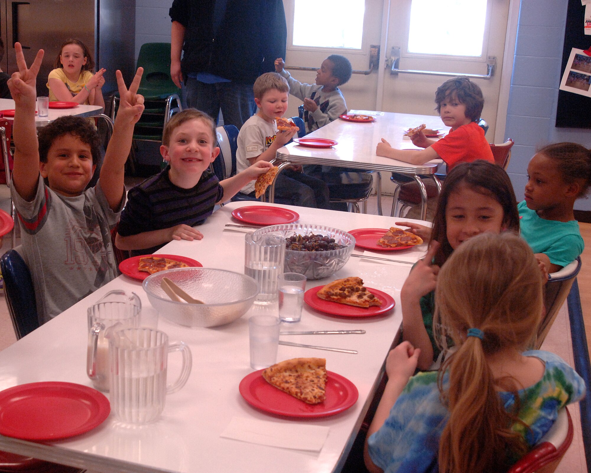 Base youth were treated to food and a game of dodgeball at the Youth Center on Grand Forks Air Force Base, N.D., on April 26, 2013. NCO professionals' organization, Network 5/6, bought the children of the youth center 10 pizzas in celebration of this year's Month of the Military Child. (U.S. Air Force photo/Airman 1st Class Zachiah Roberson)