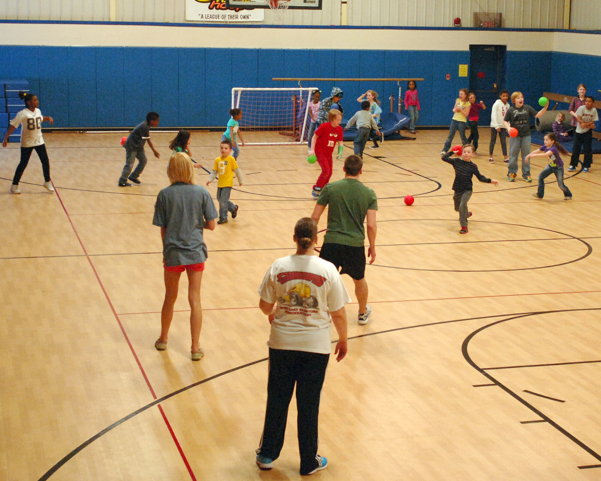 Base youth were treated to food and a fun activity at the Youth Center on Grand Forks Air Force Base, N.D., April 26, 2013. The children played dodgeball against base volunteers, some of which were parents of the children at the event. (U.S. Air Force photo/Airman 1st Class Zachiah Roberson)