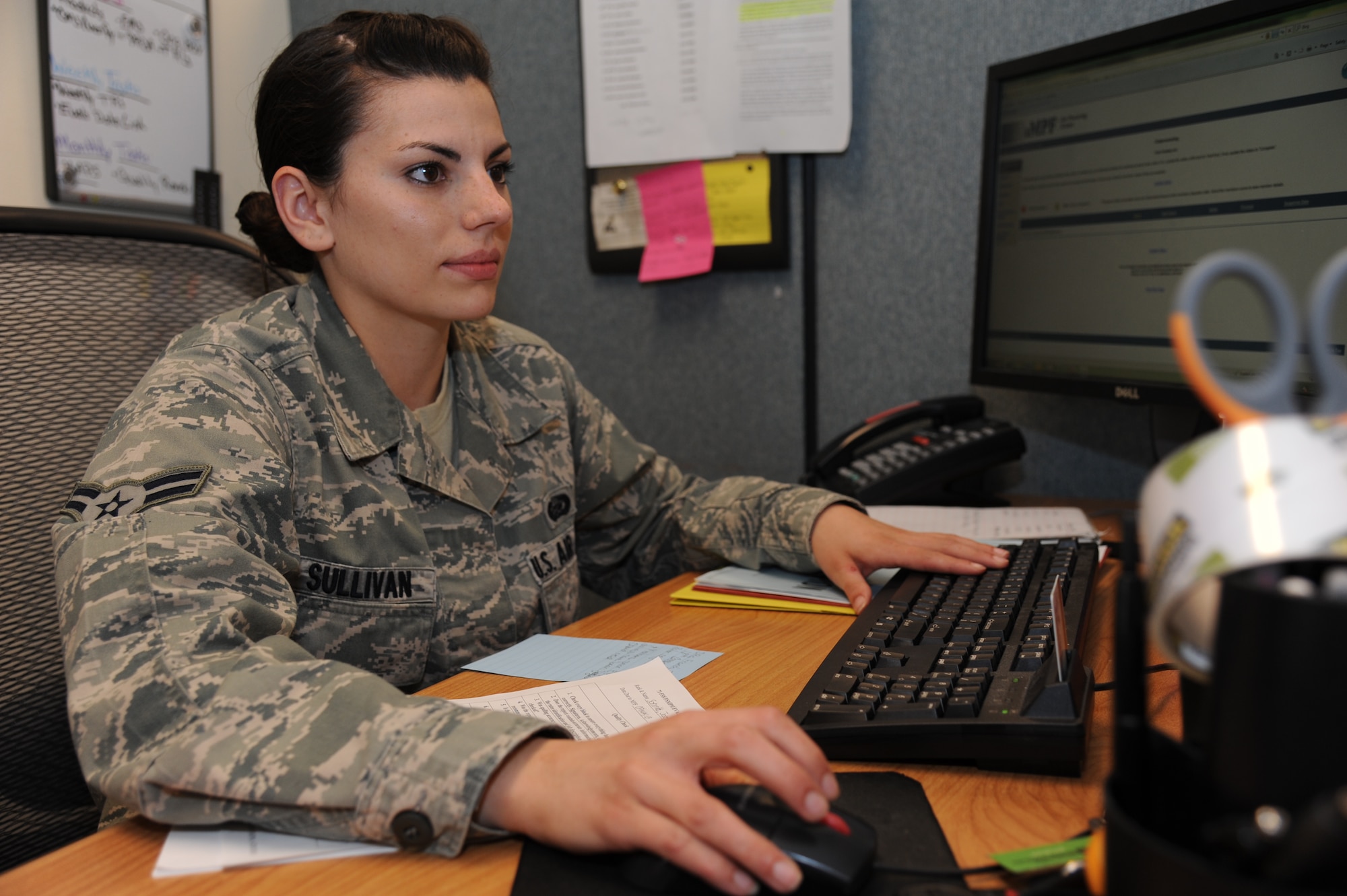Airman 1st Class Christina Sullivan, a force management technician with the 71st Force Support Squadron, evaluates content on an officer performance report at Vance Air Force Base, Okla., May 1. (U.S. Air Force photo/ Senior Airman Frank Casciotta)