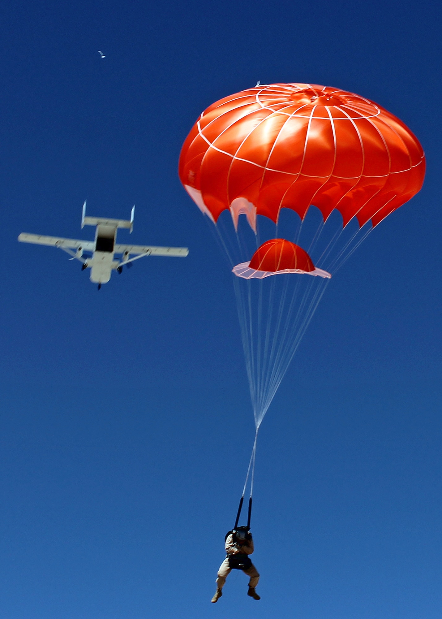 Tech. Sgt. Joseph Monreal, 418th Flight Test Squadron NCOIC of the Test Parachuting Program, deploys the Low Profile parachute after exiting a SC.7 Skyvan during a LPP test April 12, 2013 over the Edwards Farm Dropzone. The Low Profile Parachute is intended to replace the BA-22 parachute which is currently configured for use in the AC-130 gunship. (U.S. Air Force photo by Staff Sgt. Jonathan Case)