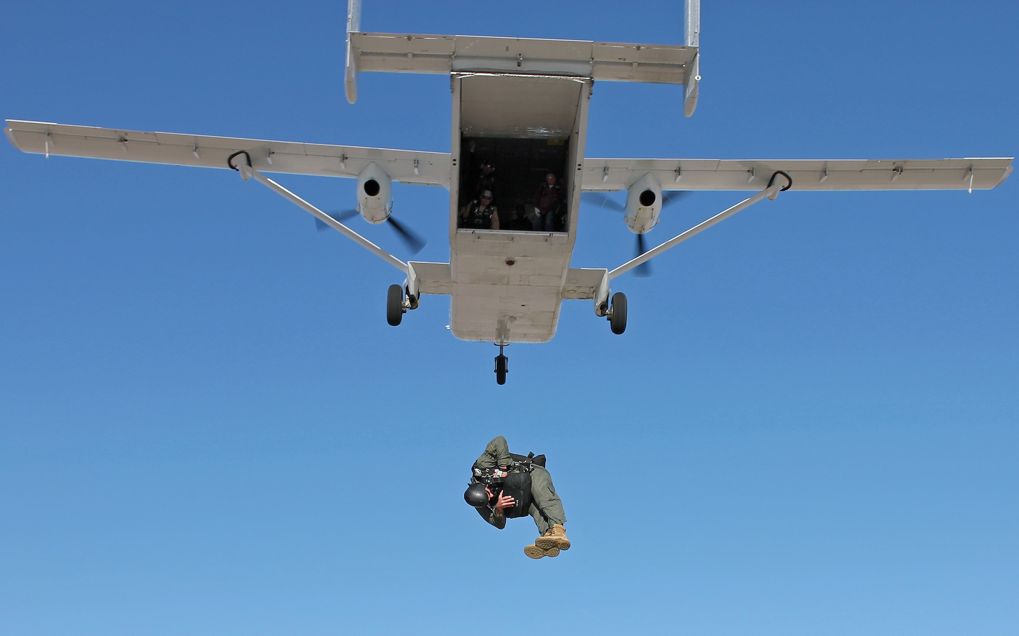 Tech. Sgt. Matthew Mensch, 418th FLTS parachute test jumper, exits a SC.7 Skyvan with a Low Profile parachute April 12, 2013 over the Edwards Farm Dropzone. The Low Profile Parachute is intended to replace the BA-22 parachute which is currently configured for use in the AC-130 gunship. (U.S. Air Force photo by Staff Sgt. Jonathan Case)