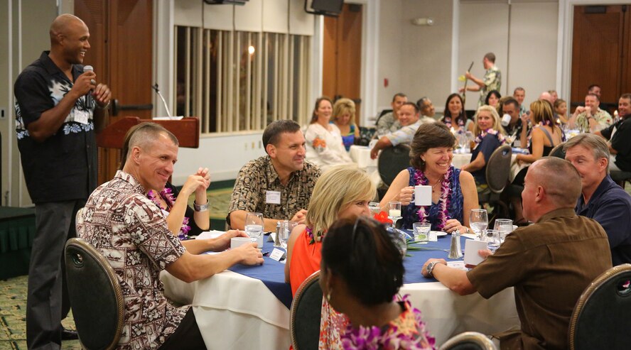 Lt. Col. Mark B. Clifford, 647th Logistics Readiness Squadron commander, jokingly speaks to attendants at the Hickam key spouse appreciation dinner, at the Tradewinds Enlisted Club, Joint Base Pearl Harbor-Hickam, Hawaii, April 25, 2013. More than 120 Key Spouses and Key Spouse Mentors were recognized at the dinner and praised for their support of military families and the Air Force squadrons their spouses serve. (Courtesy photo)