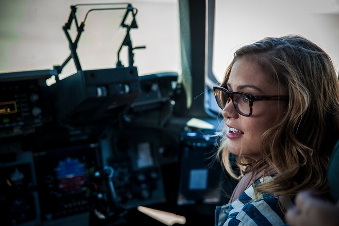 Army Wives actress Elle McLemore sits in the cockpit of a C-17 Globemaster III during a tour of the aircraft April 26, 2013, at Joint Base Charleston –Air Base, S.C. Army Wives tells the story of four women and one man who are brought together by their common bond - they all have military spouses. The series is based on the book "Under the Sabers: The Unwritten Code of Army Wives" by Tanya Biank and is produced by ABC Television Studio and The Mark Gordon Company. (U.S. Air Force photo/Senior Airman Dennis Sloan)