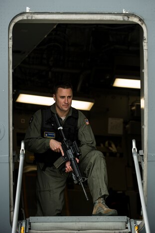 Technical Sgt. Stephen Beckemeyer, 628th Security Forces Squadron Ravens member, demonstrates an armed overwatch for the TODAY Show crew during a visit April 19, 2013, at Joint Base Charleston – Air Base, S.C. NBC correspondent Sara Haines met with members from the 437th Aircraft Maintenance Squadron, 14th Airlift Squadron, 628th Security Forces Squadron Ravens team and 437th Aerial Port Squadron for a segment for the TODAY show. Each interview included hands-on interaction with Airmen who explained their jobs and their roles in achieving the Air Force mission. (U.S. Air Force photo/ Senior Airman George Goslin)