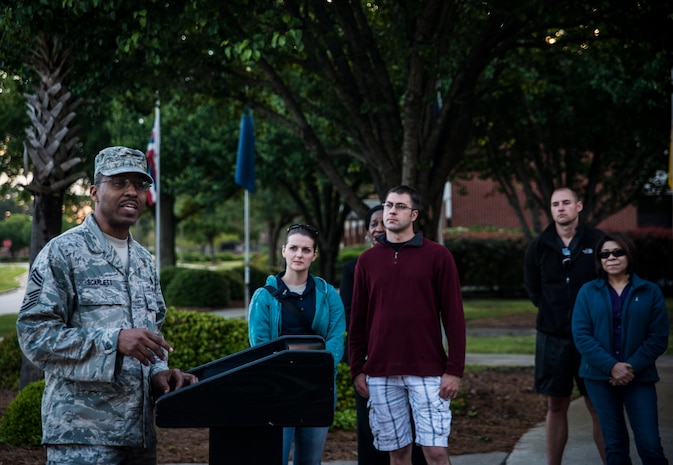 Chief Master Sgt. Robert Scarlett, 437th Aircraft Maintenance Squadron maintenance superintendent, gives the opening remarks at the “Take Back the Night Walk” April 30, 2013, at Joint Base Charleston – Air Base, S.C. The event marked the end of Sexual Assault Awareness Month. (U.S. Air Force photo/ Senior Airman Dennis Sloan)