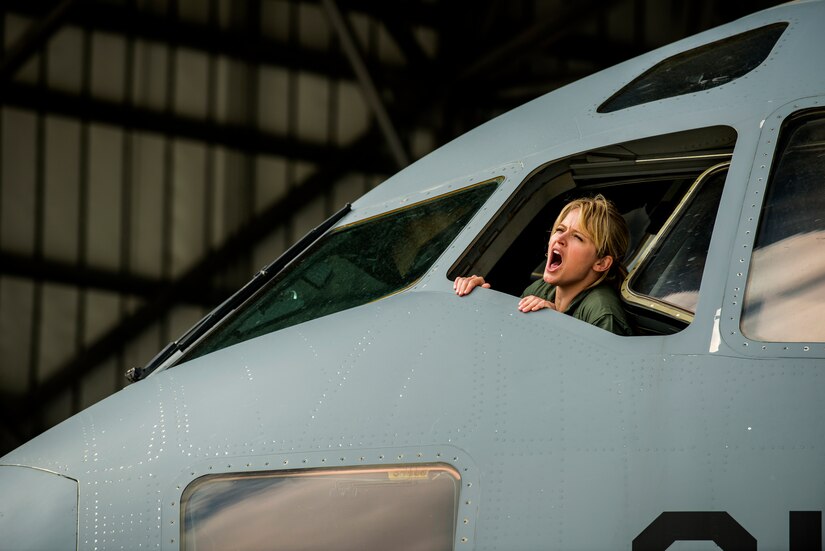 Sara Haines, NBC TODAY Show correspondent, yells out of a C-17 Globemaster III window to signal hydraulic pumps coming online during a visit April 19, 2013, at Joint Base Charleston – Air Base, S.C. Haines met with members from the 437th Aircraft Maintenance Squadron, 14th Airlift Squadron, 628th Security Forces Squadron Ravens team and 437th Aerial Port Squadron for a segment for the TODAY Show. Each interview included hands-on interaction with Airmen who explained their jobs and their roles in achieving the Air Force mission.  (U.S. Air Force photo/ Senior Airman George Goslin)