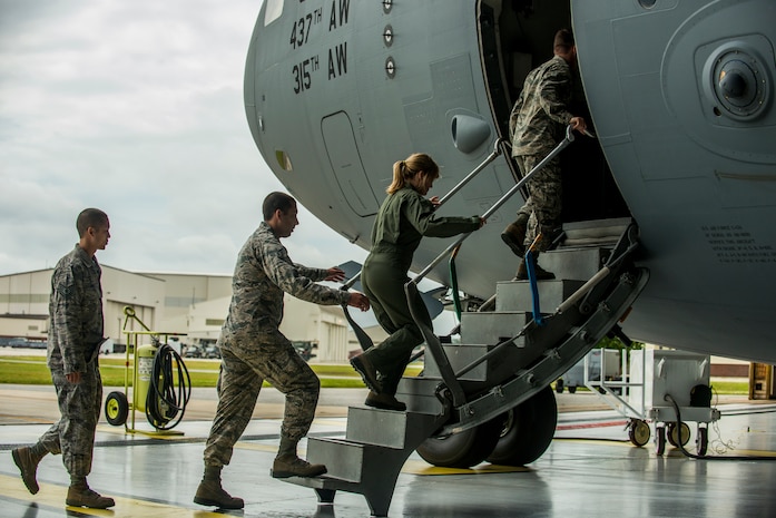 Sara Haines, NBC TODAY Show correspondent, boards a C-17 Globemaster III with Tech. Sgt. James Davis and Senior Airman Jay O’Neil, 437th Aircraft Maintenance Squadron crew chiefs, and Senior Airman Anthony McCourt, 315th Aircraft Maintenance Squadron crew chief April 19, 2013, at Joint Base Charleston – Air Base, S.C. Haines met with members from the 437th Aircraft Maintenance Squadron, 14th Airlift Squadron, 628th Security Forces Squadron Ravens team and 437th Aerial Port Squadron for a segment for the TODAY Show. Each interview included hands-on interaction with Airmen who explained their jobs and their roles in achieving the Air Force mission. (U.S. Air Force photo/ Senior Airman George Goslin)