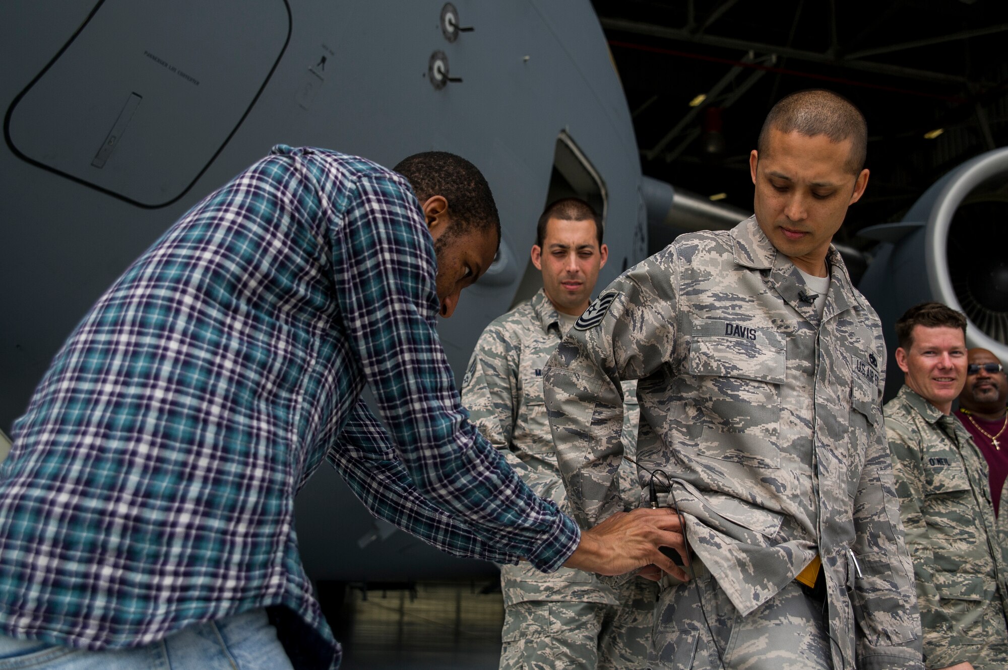 Durrell Dawson, an NBC TODAY Show producer, mics Tech. Sgt. James Davis, 437th Aircraft Maintenance Squadron crew chief, during the TODAY Show’s visit April 19, 2013, at Joint Base Charleston – Air Base, S.C. The TODAY Show crew was preparing segments for a telecast scheduled to air May 3, 2013. (U.S. Air Force photo/ Senior Airman George Goslin)