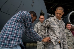 Durrell Dawson, an NBC TODAY Show producer, mics Tech. Sgt. James Davis, 437th Aircraft Maintenance Squadron crew chief, during the TODAY Show’s visit April 19, 2013, at Joint Base Charleston – Air Base, S.C. The TODAY Show crew was preparing segments for a telecast scheduled to air May 3, 2013. (U.S. Air Force photo/ Senior Airman George Goslin)