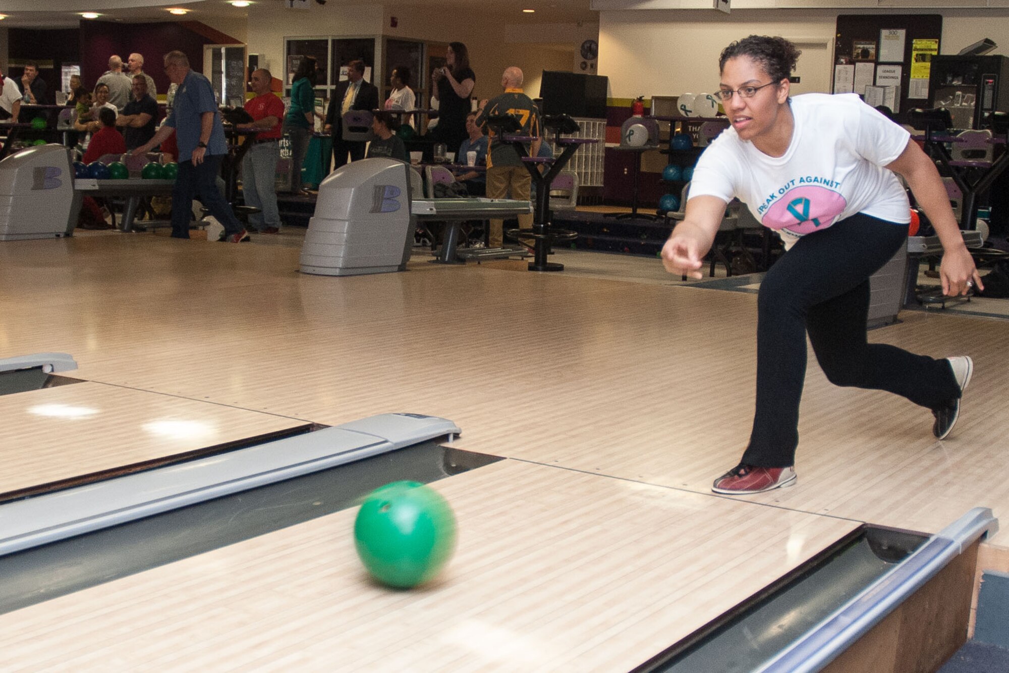 HANSCOM AIR FORCE BASE, Mass -- Tech. Sgt. Chrystle Harvey, 66th Comptroller Squadron, releases the ball during a "Strike Against Sexual Assault" event at the bowling center April 25. Bowlers participated in the event that was part of Sexual Assault Awareness Month and included food, competition and education. (U.S. Air Force photo by Mark Herlihy)