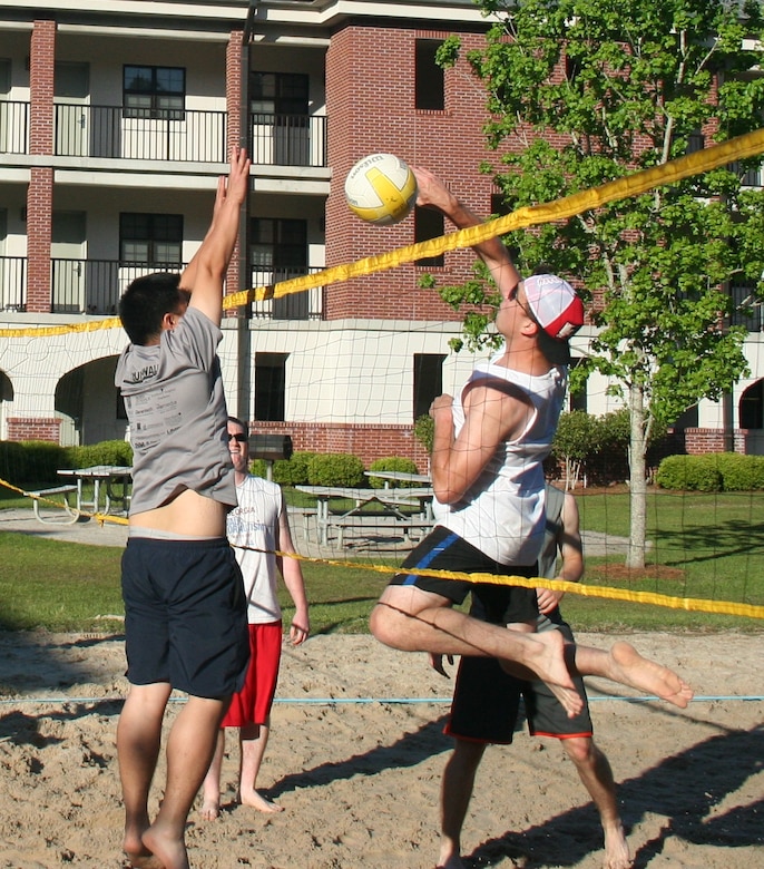 Sailors compete in a volleyball tournament April 26, 2013, at the Naval Nuclear Power Training Command at Joint Base Charleston – Weapons Station, S.C., as part of sexual assault awareness month. The event helped collect donations for local organizations committed to assisting victims of rape and sexual assault and raised sexual assault awareness among staff and students. (U.S. Navy photo by Mass Communication Specialist Seaman Jason Pastrick / Released)