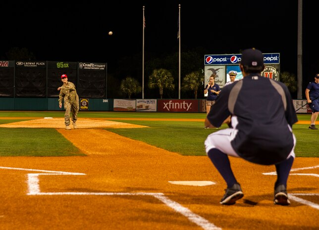 Staff Sgt. Kelly Brown, 560th Red Horse Squadron structures engineer, throws out the first pitch of the Charleston RiverDogs Military Appreciation Night game April 25, 2013, at the Joseph P. Riley, Jr. Park in Charleston, S.C. The Charleston RiverDogs hosted Military Appreciation night to show their support for the local military. (U.S. Air Force photo/ Senior Airman George Goslin)