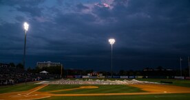 Members of the Charleston RiverDogs staff pull away the infield tarp during the Charleston RiverDogs Military Appreciation Night game April 25, 2013, at the Joseph P. Riley, Jr. Park in Charleston, S.C. The Charleston RiverDogs hosted Military Appreciation night to show their support for the local military. (U.S. Air Force photo/ Senior Airman George Goslin)
