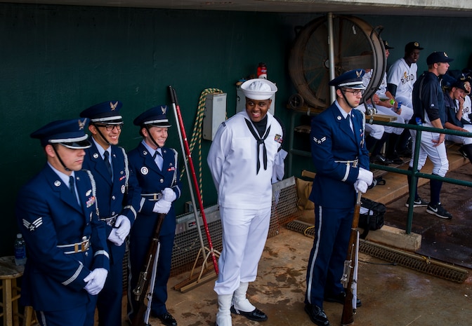 Members of the Joint Base Charleston Honor Guard wait for a rain delay to end during the Charleston RiverDogs Military Appreciation Night game April 25, 2013, at the Joseph P. Riley, Jr. Park in Charleston, S.C. The Charleston RiverDogs hosted Military Appreciation night to show their support for the local military. (U.S. Air Force photo/ Senior Airman George Goslin)