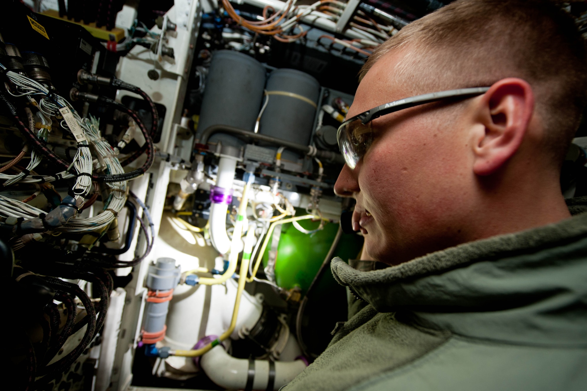 Senior Airman Brandon Jadwin, 28th Aircraft Maintenance Squadron electrical and environmental technician, inspects the molecular sieve oxygen generating system in a B-1 at Ellsworth Air Force Base, S.D., April 4, 2013. The MSOG supplies clean oxygen to the aircrew’s flight masks. (U.S. Air Force photo by Airman 1st Class Zachary Hada/Released)