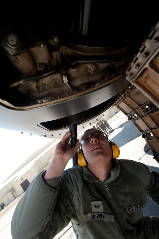 Senior Airman Brandon Jadwin, 28th Aircraft Maintenance Squadron electrical and environmental technician, checks the inside of an access panel to inspect the integrated drive generator systems on a B-1 bomber at Ellsworth Air Force Base, S.D., April 4, 2013. Electrical environmental specialists have knowledge of electronic, mechanical and electrical principles relating to electrical and environmental systems, concepts and application of maintenance directives. (U.S. Air Force photo by Airman 1st Class Zachary Hada/Released)