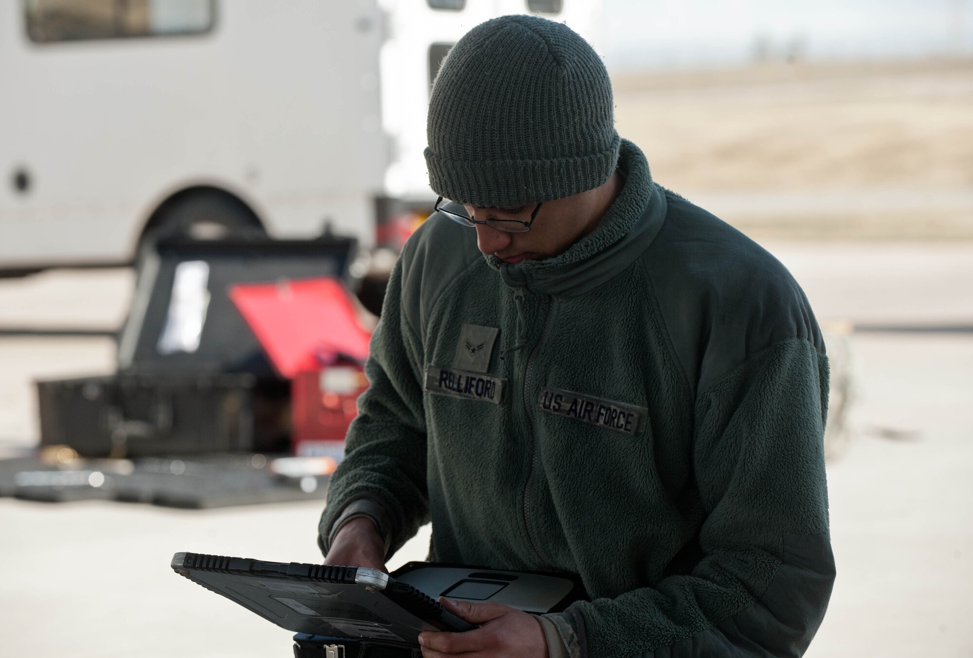 Airman 1st Class Kyle Relliford, 28th Aircraft Maintenance Squadron electrical and environmental technician, reviews a technical order before inspecting electrical systems on a B-1 bomber at Ellsworth Air Force Base, S.D., April 4, 2013. The 28th AMXS is the largest squadron in the 28th Bomb Wing, with more than 700 Airmen supporting Ellsworth’s combat coded B-1 bombers. (U.S. Air Force photo by Airman 1st Class Zachary Hada/Released)
