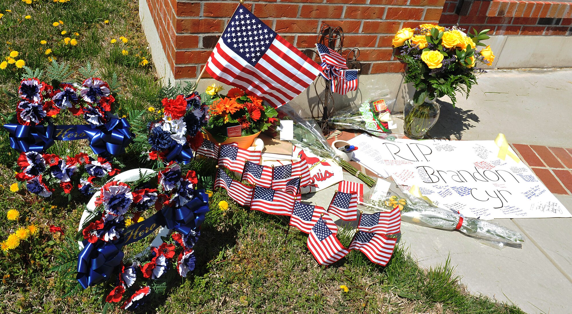 Members of Team Scott display their affection for Capt. Brandon Cyr after learning about his death April 27, 2013 while serving in Afghanistan. He and three other Airmen were killed when their MC-12 crashed in the Zabul province. He was an active duty member assigned to the 906th Air Refueling Squadron within the 375th Air Mobility Wing here, and he flew KC-135 aircraft under the direction of the 126th Air Refueling Wing (Guard). (U.S. Air Force Photo/illustration by Airman Jaeda Waffer)