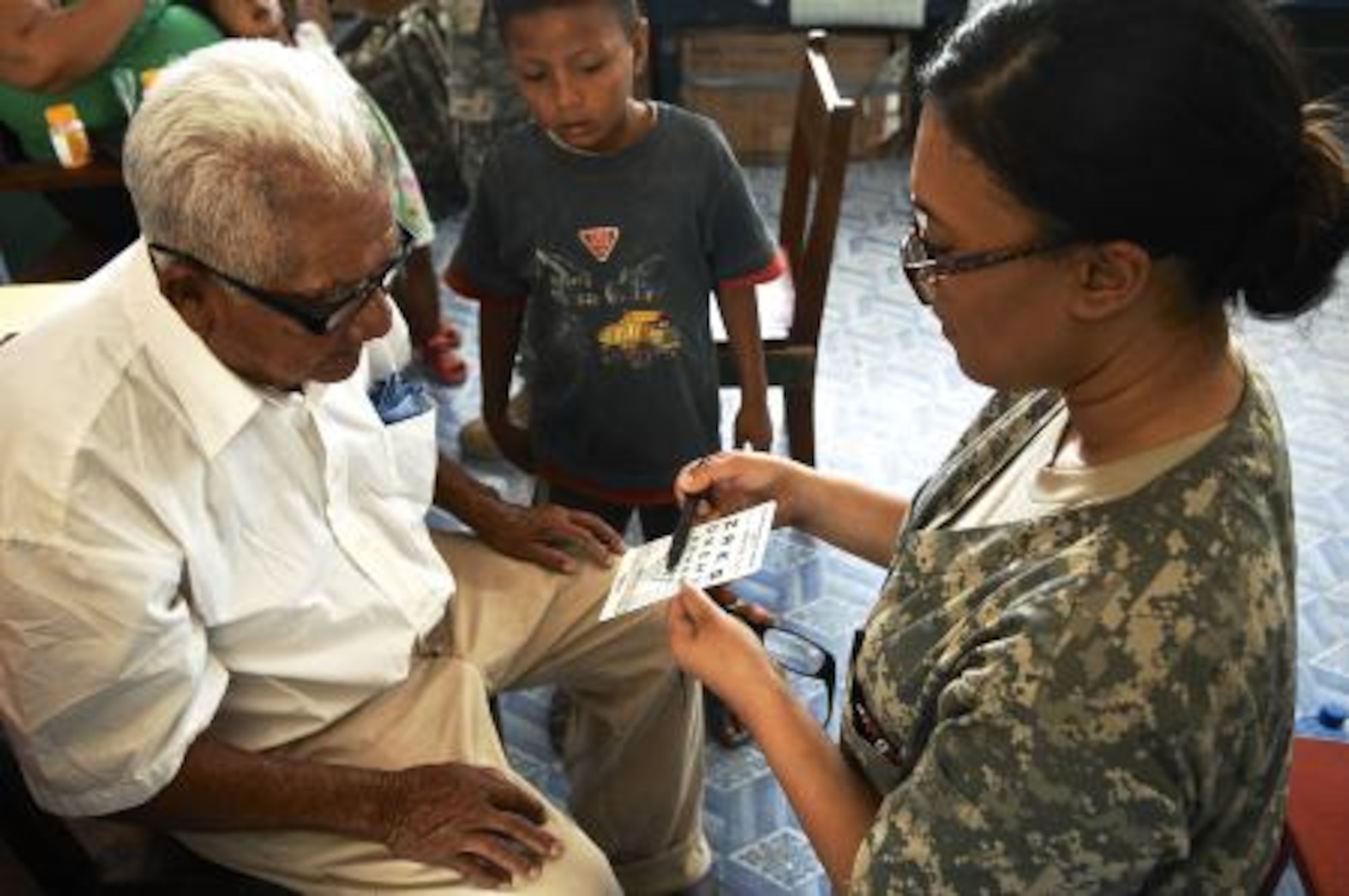 U.S. Army Pfc. Sierra Chanel, optical lab specialist assigned to the 362nd Medical Logistics Company, checks a local resident’s vision at San Filipe School, Belize, April 24, 2013. Medical professionals from the U.S. and Canada provided free medical treatment during medical readiness training exercises throughout Belize as part of an on-going exercise known as New Horizons. The MEDRETES were designed to provide humanitarian assistance and medical care to people in several communities, while helping improve the skills of U.S. military medical forces. (U.S. Air Force photo by Master Sgt. James Law/Released)
