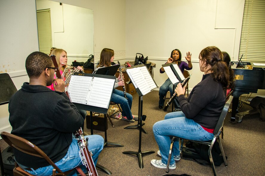 Staff Sgt. Sarah Carter, Band of the U.S. Air Force Reserve flutist, gives feedback to students during a small group rehearsal Feb. 11, 2013, at Mercer University’s Newton Chapel.  The students perform in the Macon Symphony Youth Orchestra, a musical organization that provides extensive rehearsal and performance opportunities to young musicians. MSYO is comprised of approximately 85 students, ages nine to eighteen, representing over thirty school s in Macon, Warner Robins, Perry, and the surrounding areas. (U.S. Air Force photo by Staff Sgt. Alexy Saltekoff)