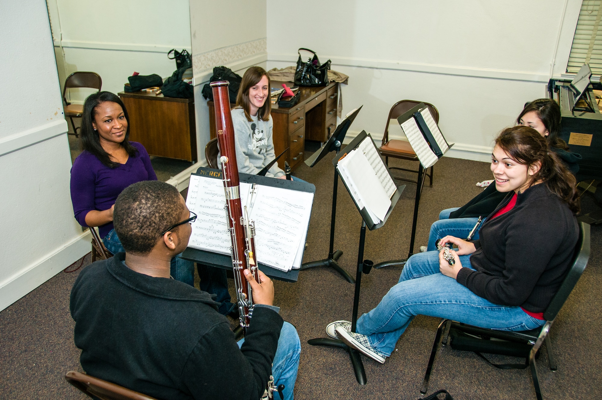 Staff Sgt. Sarah Carter, Band of the U.S. Air Force Reserve flutist, prepares for a Macon Symphony Youth Orchestra small group rehearsal Feb. 11, 2013, at Mercer University’s Newton Chapel. Macon Symphony Youth Orchestra is a musical organization that provides extensive rehearsal and performance opportunities to young musicians. MSYO is comprised of approximately 85 students, ages nine to eighteen, representing over thirty school s in Macon, Warner Robins, Perry, and the surrounding areas. (U.S. Air Force photo by Staff Sgt. Alexy Saltekoff)