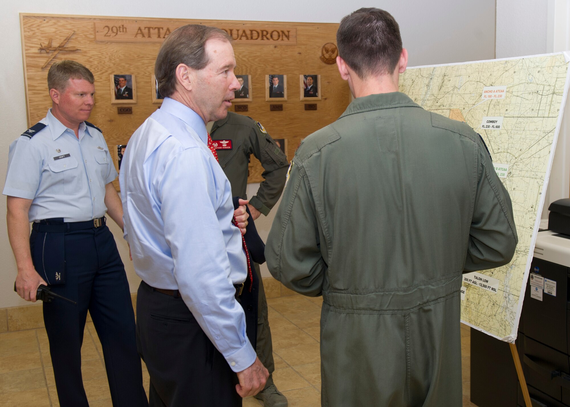 Senator Tom Udall of New Mexico receives a briefing on the New Mexico airspace from Maj. Daniel George, a remotely piloted aircraft pilot from the 29th Attack Squadron at Holloman Air Force Base, N.M., April 29. Udall was informed of current RPA flight restrictions and how the available airspace plays a part in that. (U.S. Air Force photo by Senior Airman DeAndre Curtiss/Released)