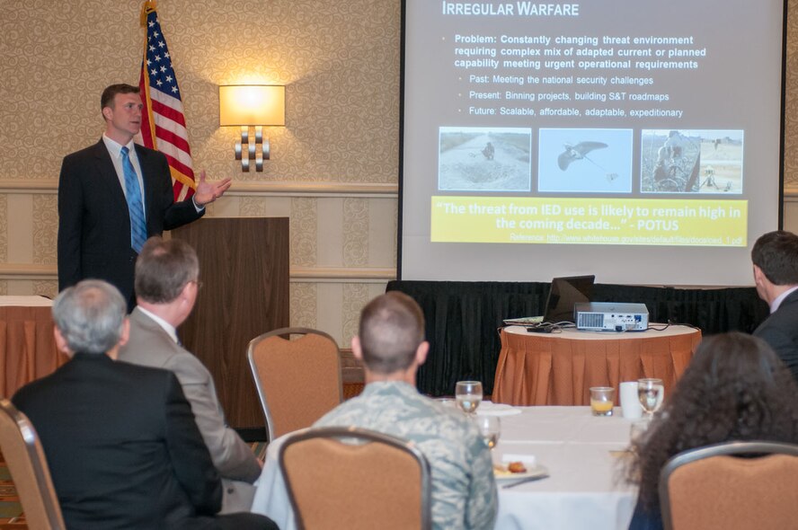 WOBURN, Mass. - Donald MacMillan, Irregular Warfare/Counter-IED Project Office lead, speaks to attendees at the Military Affairs Council breakfast meeting April 25 at the Hilton hotel. MacMillan spoke about irregular warfare and the work his office at Hanscom is doing to help combat the threat. (U.S. Air Force photo by Rick Berry)