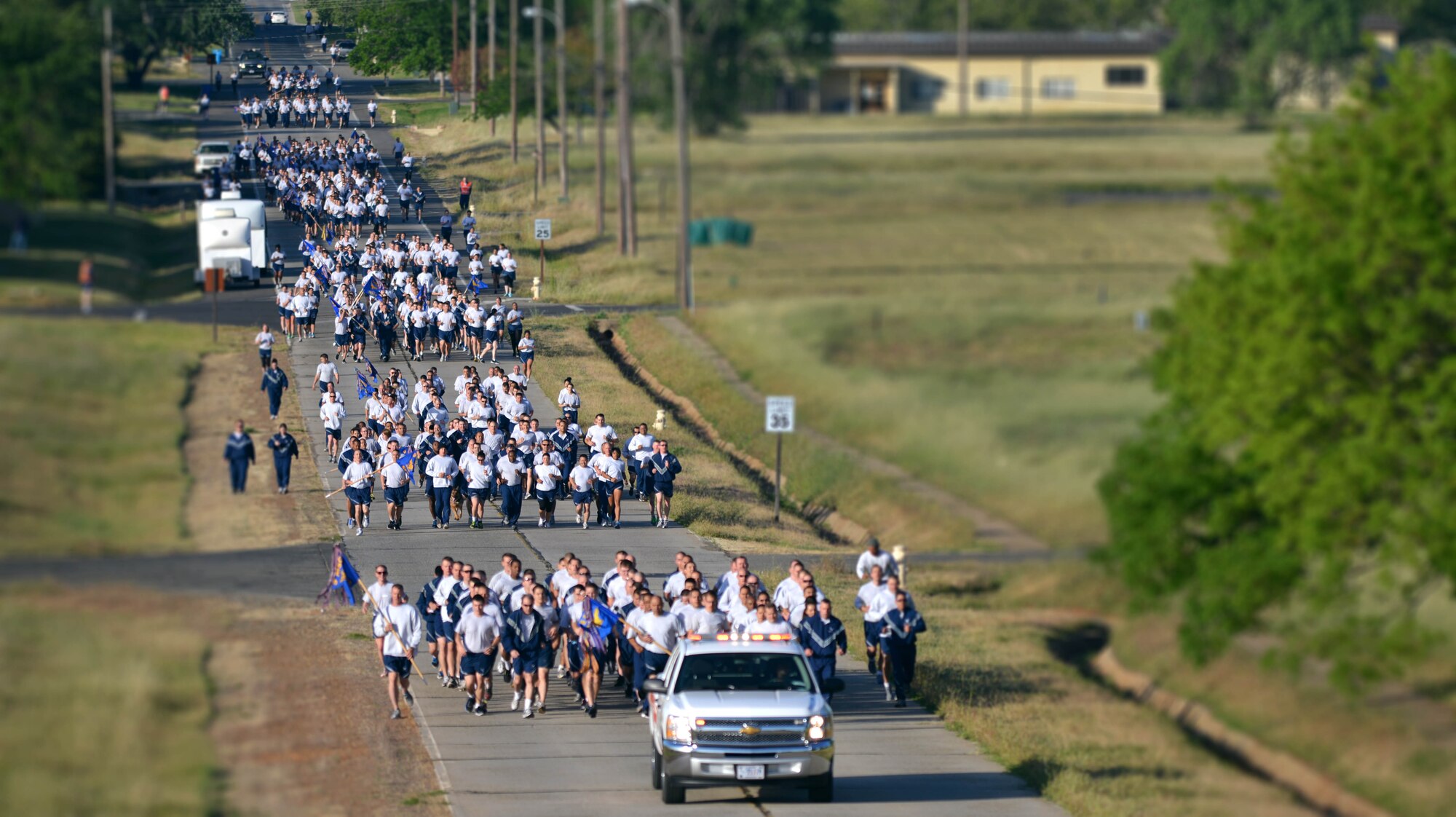 Team Beale participates in a wing run on Beale Air Force Base Calif., April 25, 2013. Col. Phil Stewart, 9th Reconnaissance Wing commander, led the way during the-two mile run. (U.S. Air Force illustration by Airman 1st Class Andrew Buchanan/Released)