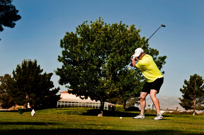 U.S. Air Force Chief Master Sgt. Brian Creswell, 99th Security Forces Squadron manager, tees off on the first hole of the Air Force Assistance Fund Golf Tournament April 26, 2013, at the Sunrise Vista Golf Course at Nellis Air Force Base, Nev. The AFAF golf tournament raised $3,400 dollars, the campaign began on March 25 and has been extended untill May 10. (U.S. Air Force photo by Senior Airman Daniel Hughes) 