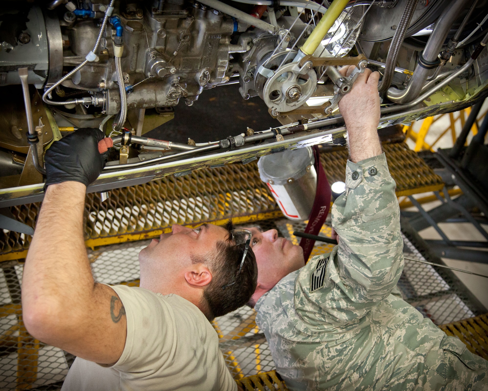 Tech. Sgt. Anthony Kanugh and Senior Airman Michael Veile, 934th Maintenance Squadron, complete a final production inspection on an a C-130 engine during an isochronal inspection at the Minneapolis-St. Paul Air Reserve Station, Minn.  (U.S. Air Force photo/Shannon McKay)