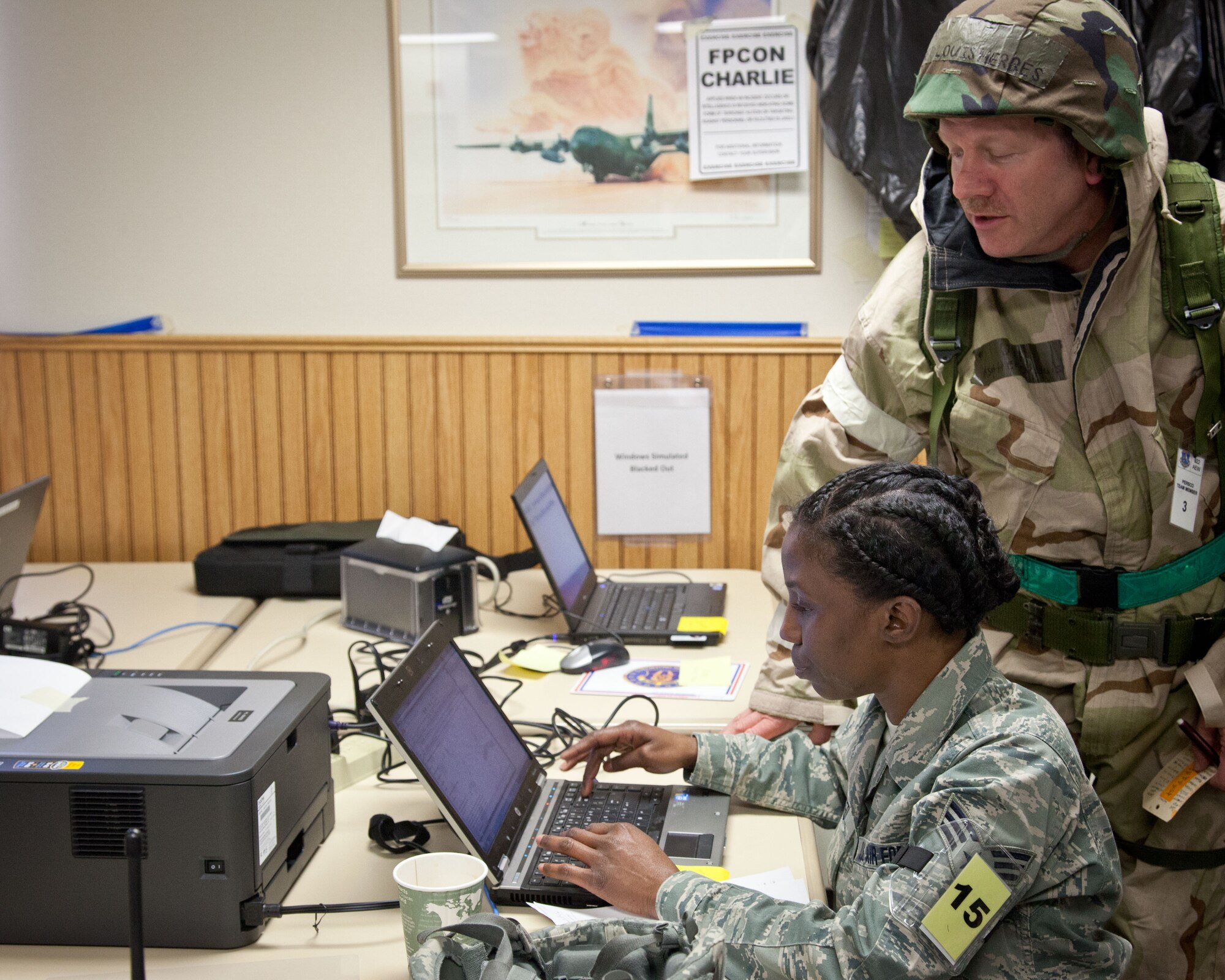 Master Sgt. Louis Herbes and Senior Airman Nichole Reed, 934th Force Support Squadron personnel support for contingency operations team members, fill out forms for in-processing and lodging.  Members of the 934 FSS prepared for the June Wing Readiness Exercise by completing a mini home station training exercise April 23-25 at the Minneapoils-St. Paul Air Reserve Station, Minn.  (U.S. Air Force photo/Shannon McKay)