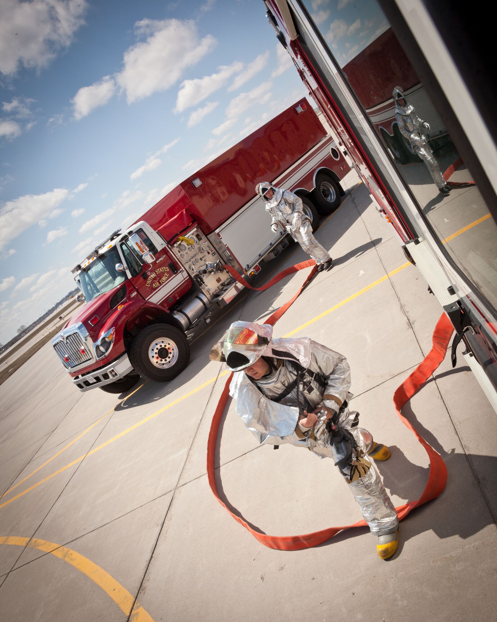 Firefighters from the 934th Civil Engineer Squadron test their skills responding to a simulated C-130 fire during an aircraft emergency exercise at the Minneapolis-St. Paul Air Reserve Station, Minn.  (U.S. Air Force photo/Shannon McKay)
