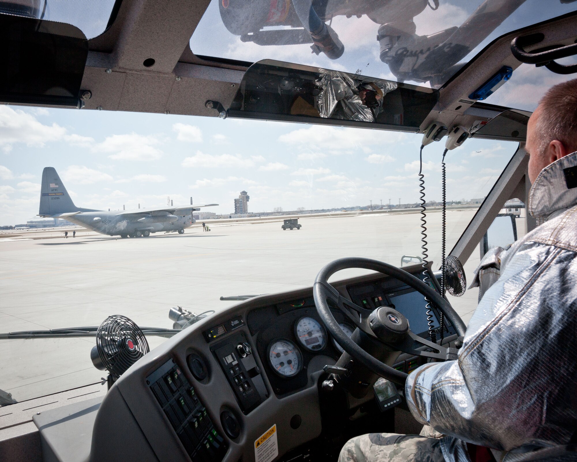 Firefighters from the 934th Civil Engineer Squadron test their skills responding to a simulated C-130 fire during an aircraft emergency exercise at the Minneapolis-St. Paul Air Reserve Station, Minn.  (U.S. Air Force photo/Shannon McKay)