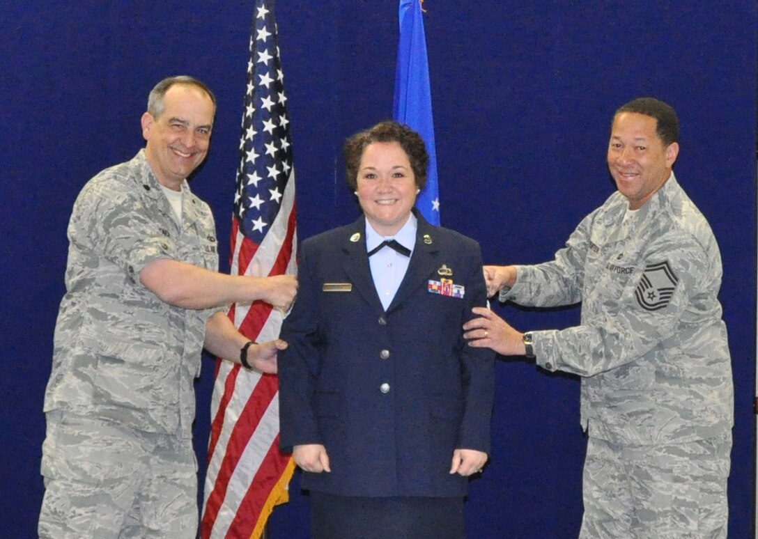 Master Sergeant (MSgt) Michele Harris gets her stripes secured as she enters the Senior NCO tier.  MSgt Harris also received her fourth Air Force commendation medal in the month of April.