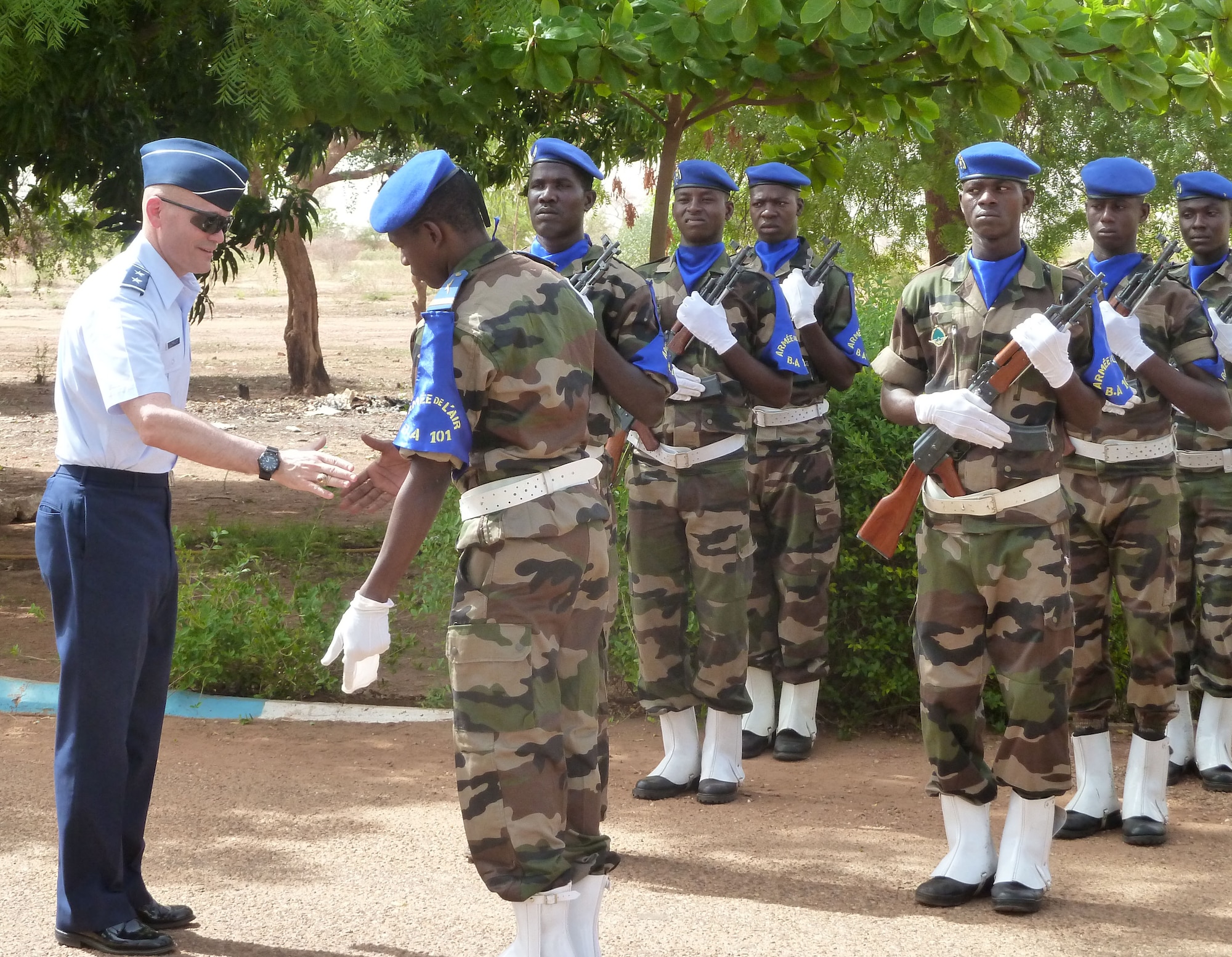 Members of the Nigerien air force greet U.S. Air Force Maj. Gen. Carlton D.
Everhart II, 3rd Air Force vice commander, during a pass and review ceremony on his visit to Base Aerienne 101 in Niamey, Niger, April 29, 2013. Everhart visited with Nigerien senior military leaders and airmen to exchange techniques and ideas on
strengthening partnership capacities between the two air forces. (U.S. Air Force photo by Capt. Reba Good/Released)
