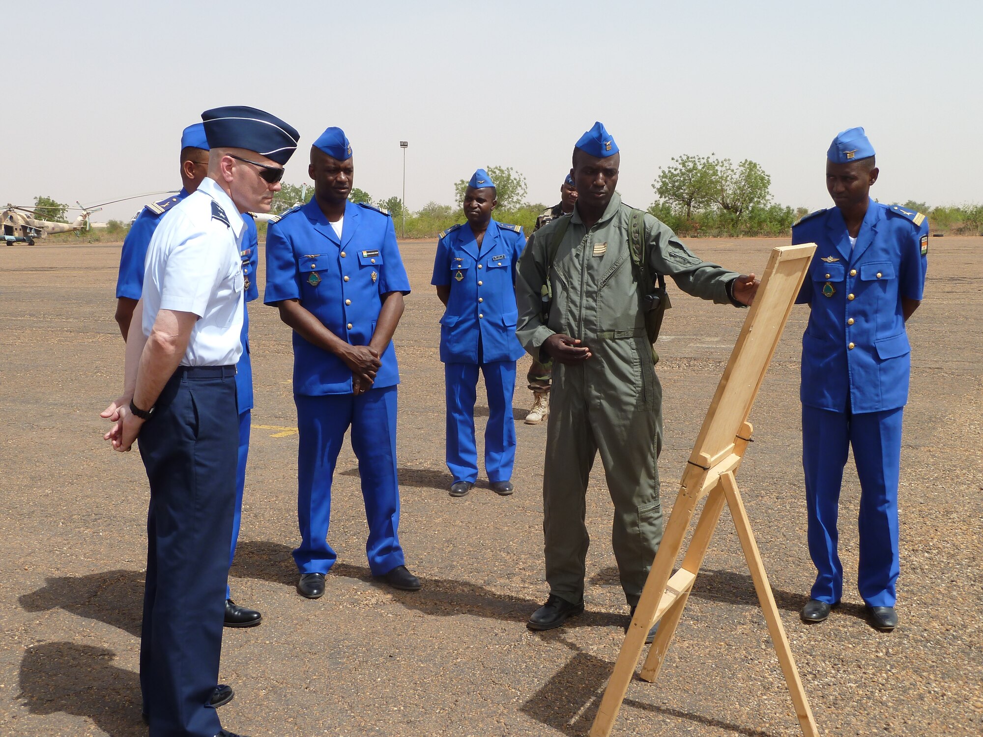 U.S. Air Force Maj. Gen. Carlton D. Everhart II, 3rd Air Force vice commander, receives a mission brief on Nigerien aircraft by members of the Nigerien air force at Base Aerienne 101, Niamey, Niger, April 29, 2013. Everhart visited with Nigerien senior military leaders and airmen to exchange techniques and ideas on
strengthening partnership capacities between the two air forces. (U.S. Air Force photo by Capt. Reba Good/Released)
