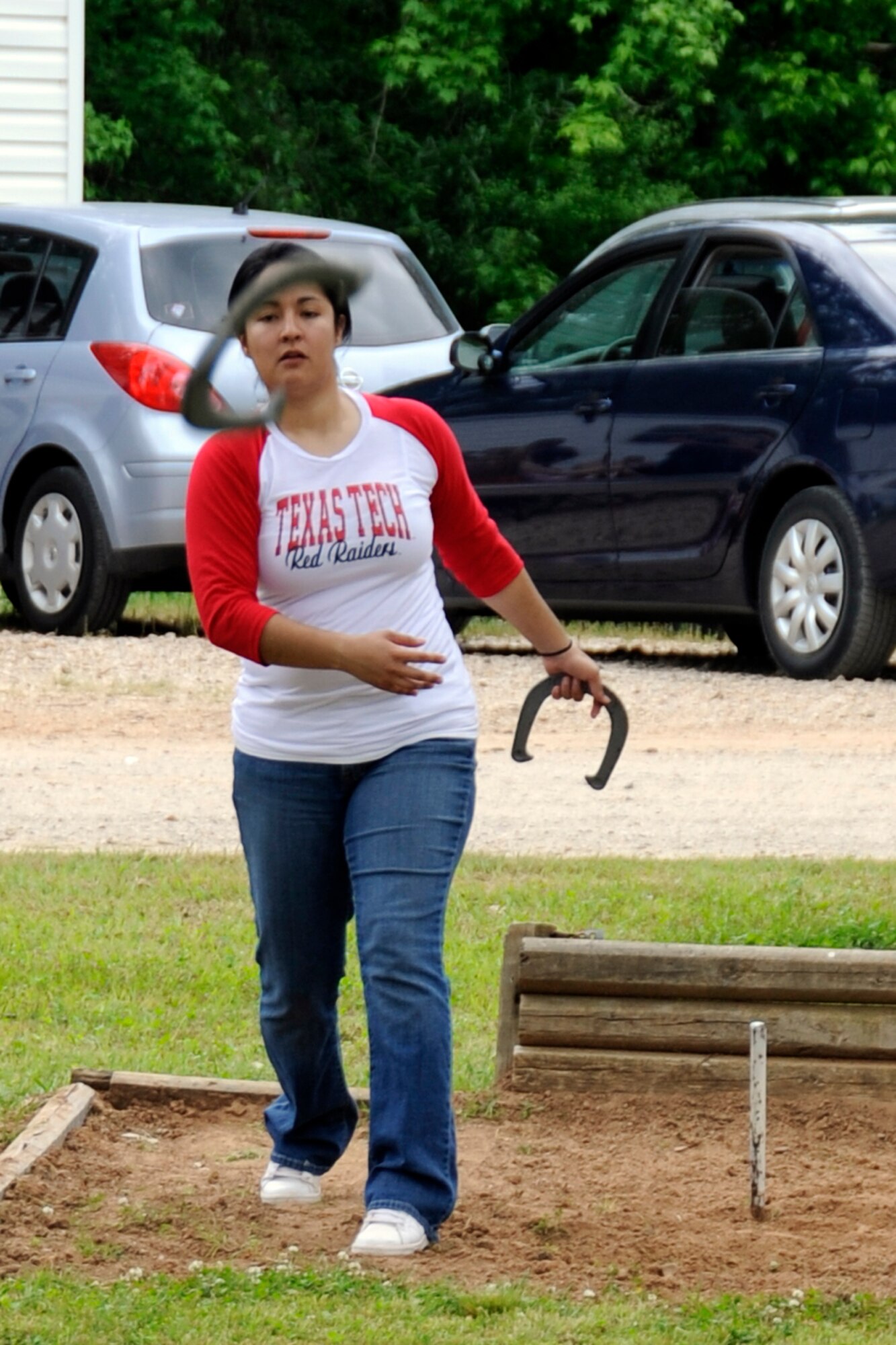 Alma Castillo participates in a game of horseshoes during the 307th Bomb Wing/917th Fighter Group Family Day at Cullen Park on Barksdale Air Force Base, La., April 28, 2012. The annual event is an opportunity for the reserve members and their families to get together for some fun and camaraderie. There was also a car show for the automotive enthusiasts at the celebration. (U.S. Air Force photo by Master Sgt. Jeff Walston/Released)