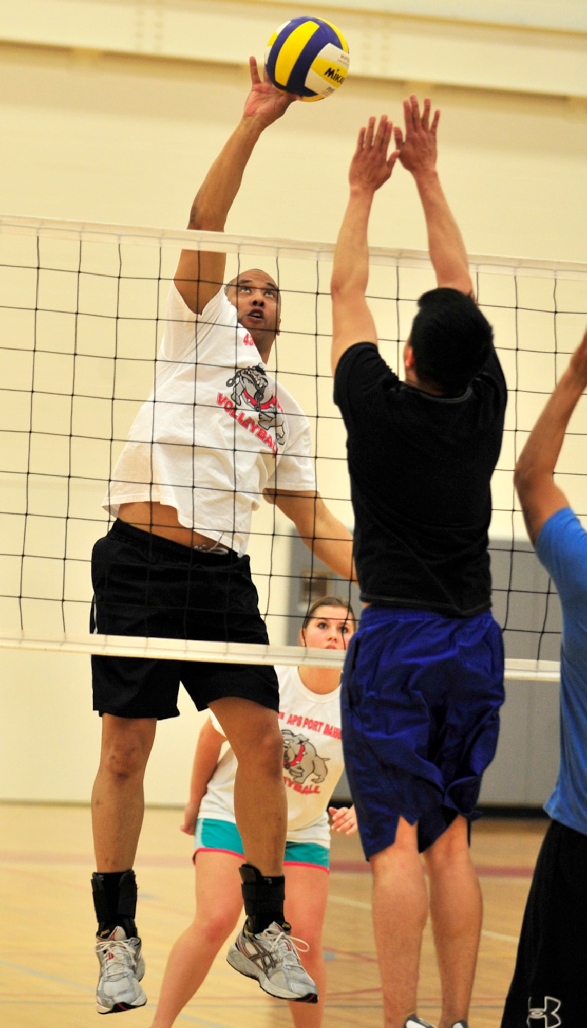 James McDonald, of the 436th Aerial Port Squadron, slams home a kill during an intramural volleyball game against the 436th Force Support Squadron April 30, 2013, at the fitness center on Dover Air Force Base, Del. The Port Dawgs swept the 436th FSS 25-21 and 25-15. (U.S. Air Force photo/Tech. Sgt. Chuck Walker)
