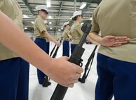 M-1 carbine rifles are perfectly positions by members of a U.S. Marine Corps Junior Reserve Officer Training Corps unit during the armed drill competition portion of the 2013 JROTC drill competition,  April 20, 2013 at Dover Air Force Base, Del. (U.S. Air Force photo/Greg L. Davis)