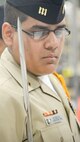 A senior ranking Navy Junior Reserve Officer Training Corps (JROTC) cadet inspects the uniform of another cadet during the 2013 JROTC drill competition, April 20, 2013, hosted by the 436th Logistics Readiness Squadron, 436th Airlift Wing, Dover Air Force Base, Del. (U.S. Air Force photo/Greg L. Davis)
