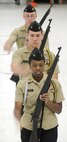 Navy Junior Reserve Officer Training Corps Cadets from Seaford High School, perform their armed drill movements during the 2013 JROTC drill competition,  April, 20, 2013 at Dover Air Force Base, Del. The 436th Logistics Readiness Squadron, 436th Airlift Wing, Dover AFB hosted the event. (U.S. Air Force photo/Greg L. Davis)