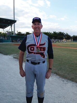 WRIGHT-PATTERSON AIR FORCE BASE, Ohio - 89th Airlift Squadron pilot Lt. Col. Philip “Hawkeye” Pierce shows off his medal after his team, the Cincinnati Colts, won the 2012 Roy Hobbs World Series championship in Ft. Myers, Fla., Nov. 10, 2012. (Courtesy photo) 