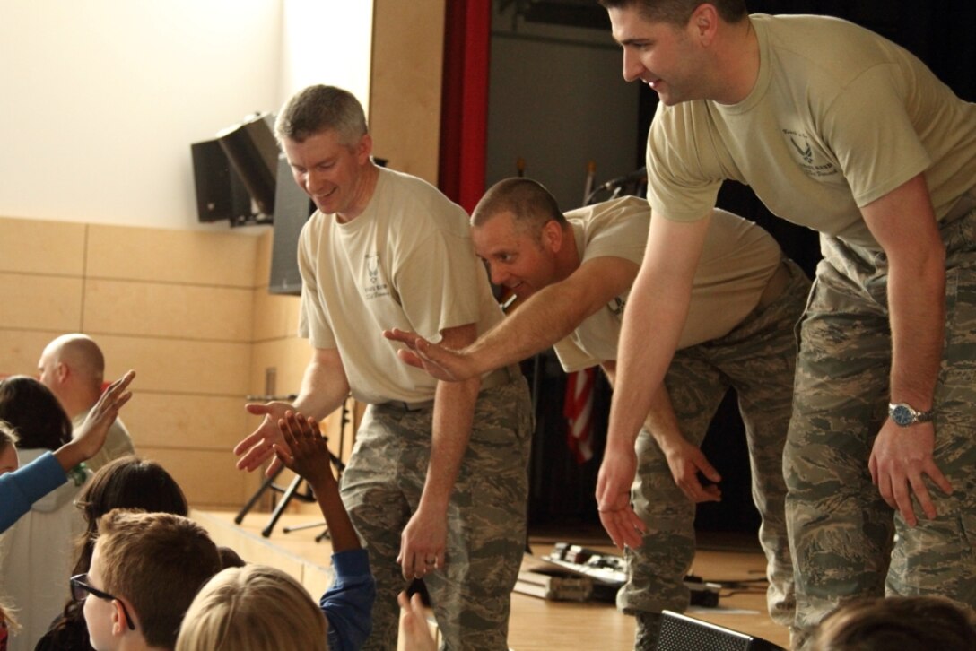 Left to Right: SSgt Robert Browning, SSgt Sam Kennedy, and SSgt Matthew Peacock connect with Wiesbaden Middle School students after a recent performance.   Music in Our Schools is an educational outreach program tailored to DoDDs students.
