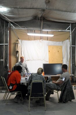 Senior Airman Michael Dekle, 386th Expeditionary Logistics Readiness Squadron leads the classroom portion a Tunner 60K cargo loader class comprised of airman and contractors at the 386th Air Expeditionary Wing, Southwest Asia Apr 27, 2013. (U.S. Air Force photo/Senior Master Sgt. George Thompson)