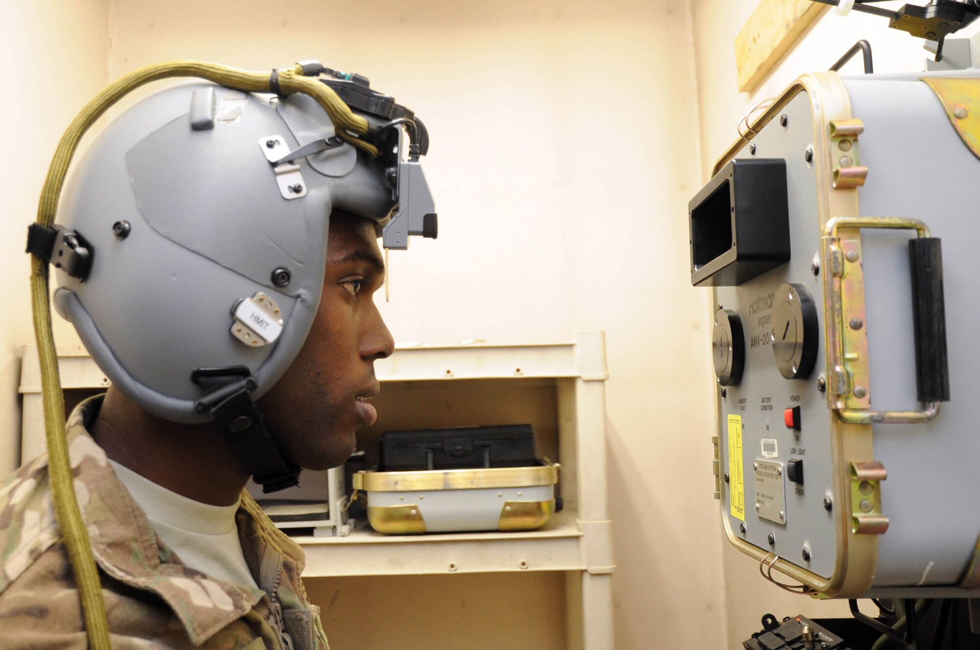 Senior Airman Dieri Dieujuste, 74th Expeditionary Fighter Squadron aircrew flight equipment technician deployed from Moody Air Force Base, Ga., tests a Scorpion Helmet-Mounted Integrated Targeting system on Bagram Airfield, Afghanistan, April 29, 2013. The aircrew flight equipment section tests all gear used  by pilots while airborne. (U.S. Air Force photo/Staff Sgt. David Dobrydney)