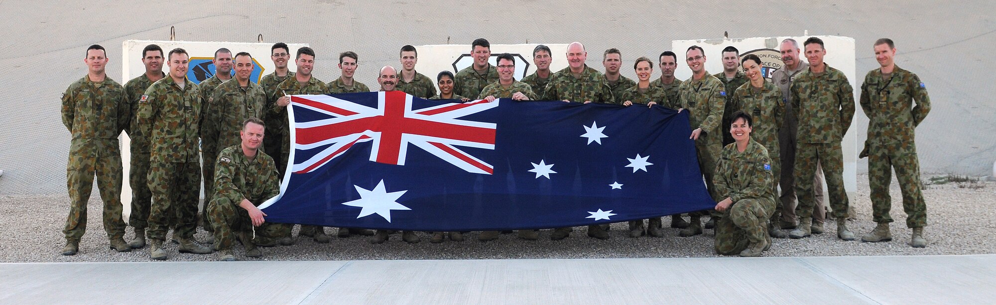 609th Air and Space Operations Center Royal Australian Air Force contingent pose for a photo March 17 at an undisclosed location Southwest Asia. (U.S. Air Force photo by Tech. Sgt. Raymond Hoy)