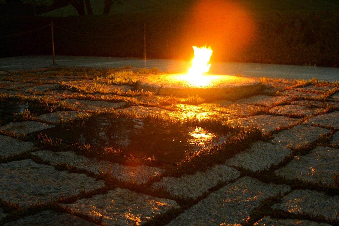 ARLINGTON, Va –The President John F. Kennedy Eternal Flame at Arlington National Cemetery  burns brightly before contractors install white fencing to block the public’s view of the site April 29, 2013.  Repairs and upgrades to the flame include installing burners, an igniter, and new gas and air lines. Contractors estimate that work on the burner itself  will take three weeks. (U.S. Army photo/Patrick Bloodgood)