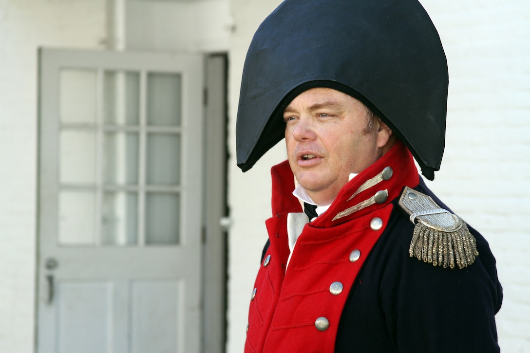 A re-enactor calls for the morning muster outside the officer's quarters at historic Fort Norfolk June 9, 2012. The fort, open for public visitation daily, is one of the last remaining 19 harbor-front forts authorized by President George Washington in 1794 and serves as the home of the Norfolk District, U.S. Army Corps of Engineers. (U.S. Army photo/Kerry Solan)