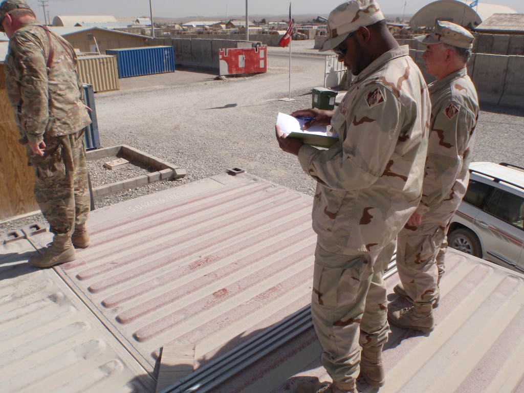 During his recent deployment to Afghanistan, Robert Medlock (center) managed construction projects in Afghanistan, one of which was on Forward Operating Base (FOB) Shank in the Logar Province. 